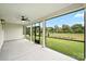 Covered screened-in porch with ceiling fan, concrete floor, and outdoor views at 13605 Tranquil Day Dr, Matthews, NC 28105