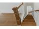 Staircase featuring wooden steps, and white and wooden banister at 13605 Tranquil Day Dr, Matthews, NC 28105