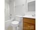 A clean bathroom features a shower and tub combination, a toilet, and vanity with storage at 14056 Lyon Hill Ln, Huntersville, NC 28078