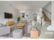 Inviting living room featuring stylish gray furniture, a cozy rug, and ample natural light at 14056 Lyon Hill Ln, Huntersville, NC 28078