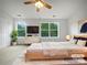 Serene main bedroom with large windows, a cozy bed, and modern furnishings, ideal for relaxation at 14056 Lyon Hill Ln, Huntersville, NC 28078