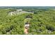 Aerial view displays home nestled among trees in a residential area at 1408 Bloomsberry Ln, Waxhaw, NC 28173
