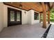 Spacious, covered back porch featuring wood ceiling, tile flooring, and decorative lighting at 1408 Bloomsberry Ln, Waxhaw, NC 28173