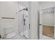 Modern bathroom with glass-enclosed shower, stylish tile, and a sleek toilet at 1408 Bloomsberry Ln, Waxhaw, NC 28173