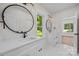 Bright bathroom featuring double vanities, sleek fixtures, and decorative mirrors at 1408 Bloomsberry Ln, Waxhaw, NC 28173