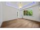 Bedroom with beautiful chandelier and large windows with gorgeous view at 1408 Bloomsberry Ln, Waxhaw, NC 28173