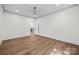 Bedroom showcasing hardwood floors, neutral walls, and a closet at 1408 Bloomsberry Ln, Waxhaw, NC 28173