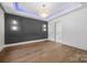 Bright dining room with wood floors, decorative wall, chandelier, and walk through access to bathroom at 1408 Bloomsberry Ln, Waxhaw, NC 28173