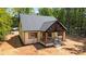 Charming single-Gathering home exterior boasting a covered porch with wood beams and a landscaped front yard at 1408 Bloomsberry Ln, Waxhaw, NC 28173
