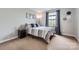 Bright bedroom featuring a comfy bed, stylish decor, and natural light from the window at 1455 Moss Creek Dr, Harrisburg, NC 28075