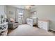 This Bedroom features carpeted floors, a window for natural light, a crib, and a dresser at 1455 Moss Creek Dr, Harrisburg, NC 28075