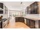 Spacious kitchen featuring granite countertops, stainless steel appliances and bright, wooden floors at 1455 Moss Creek Dr, Harrisburg, NC 28075