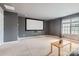 Spacious theater room with a large screen, comfortable seating, and ample space for entertaining at 1455 Moss Creek Dr, Harrisburg, NC 28075