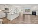 Open-concept kitchen with white cabinetry, stainless steel appliances, and a seamless flow to the living area at 15012 Meadows Hunt Ln # 157, Huntersville, NC 28078