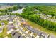 Panoramic aerial view showcasing the neighborhood, lush greenery, and a serene lake nearby at 18011 Wilbanks Dr, Charlotte, NC 28278