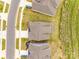 Aerial view of neighborhood showcasing the property's roof, grassy lot, and proximity to other homes at 18011 Wilbanks Dr, Charlotte, NC 28278