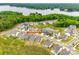 Aerial view featuring neighborhood homes, a pond, and bordering lakefront at 18011 Wilbanks Dr, Charlotte, NC 28278