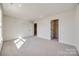 Inviting bedroom featuring neutral carpet and ample closet space at 18011 Wilbanks Dr, Charlotte, NC 28278