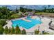 Community pool area with recreational water features, including a water slide, and plenty of lounge chairs at 18011 Wilbanks Dr, Charlotte, NC 28278
