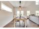 Bright dining area with stylish table set, wood floors and lots of natural light at 18011 Wilbanks Dr, Charlotte, NC 28278