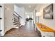 Bright foyer with hardwood floors, stairway, and a view into the living room at 18011 Wilbanks Dr, Charlotte, NC 28278