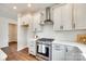 Stylish kitchen featuring stainless steel appliances, white countertops, and ample cabinet space at 18011 Wilbanks Dr, Charlotte, NC 28278