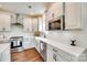 Well-lit kitchen with stainless steel appliances, white countertops, and ample storage space at 18011 Wilbanks Dr, Charlotte, NC 28278