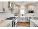 Modern kitchen featuring stainless steel appliances, white countertops, and ample cabinet space at 18011 Wilbanks Dr, Charlotte, NC 28278