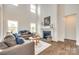 Bright living room with a cozy fireplace, tall ceilings and lots of natural light at 18011 Wilbanks Dr, Charlotte, NC 28278