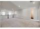 Spacious loft area with neutral carpeting, recessed lighting and natural light at 18011 Wilbanks Dr, Charlotte, NC 28278
