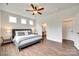 Modern main bedroom with hardwood floors and natural light through the windows at 18011 Wilbanks Dr, Charlotte, NC 28278