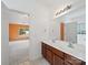 Dual sink vanity bathroom features a large mirror and an adjoining room at 2020 White Cedar Ln, Waxhaw, NC 28173