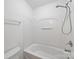Clean bathroom with a white tub and shower featuring modern fixtures at 2020 White Cedar Ln, Waxhaw, NC 28173
