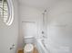 Bathroom featuring a unique circular window and modern shower and tub at 2020 White Cedar Ln, Waxhaw, NC 28173