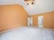 Carpeted bedroom with a vaulted ceiling and natural light from a large window at 2020 White Cedar Ln, Waxhaw, NC 28173