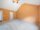 Carpeted bedroom with a vaulted ceiling and natural light from a large window at 2020 White Cedar Ln, Waxhaw, NC 28173