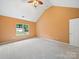 Spacious carpeted bedroom with vaulted ceiling and natural light from a large window at 2020 White Cedar Ln, Waxhaw, NC 28173