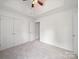 Spacious bedroom featuring a ceiling fan and closet with ample storage space at 2020 White Cedar Ln, Waxhaw, NC 28173