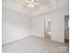 Bedroom with tray ceiling and neutral carpet, offering a serene retreat at 2020 White Cedar Ln, Waxhaw, NC 28173