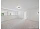 Expansive bonus room featuring carpet flooring, natural light and neutral tones at 2020 White Cedar Ln, Waxhaw, NC 28173