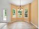 Eat-in kitchen features lots of natural light and a chandelier at 2020 White Cedar Ln, Waxhaw, NC 28173