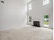 Bright living room with high ceilings, a cozy fireplace, and stylish neutral decor at 2020 White Cedar Ln, Waxhaw, NC 28173