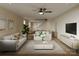 Bright, open living room featuring neutral decor, hardwood floors, and a modern ceiling fan at 2432 Arty Ave, Charlotte, NC 28208