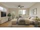 Serene main bedroom with ample natural light, wood floors, and a door to the outside at 2432 Arty Ave, Charlotte, NC 28208