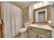 Bathroom featuring stylish shower curtain, vanity and toilet at 2915 Cherry Blossom Ct, Fort Mill, SC 29715