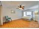 Bright bedroom featuring hardwood floors, a ceiling fan, and a bay window at 2915 Cherry Blossom Ct, Fort Mill, SC 29715