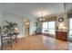 Bright dining room featuring hardwood floors, large windows, and classic decor at 2915 Cherry Blossom Ct, Fort Mill, SC 29715