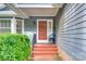 Inviting front porch with brick steps, a chair, and classic details at 2915 Cherry Blossom Ct, Fort Mill, SC 29715