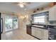 Bright kitchen with tile floors, black countertops, and stainless steel dishwasher at 2915 Cherry Blossom Ct, Fort Mill, SC 29715