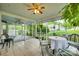 Cozy screened porch with furniture and ceiling fans, perfect for outdoor relaxation at 2915 Cherry Blossom Ct, Fort Mill, SC 29715